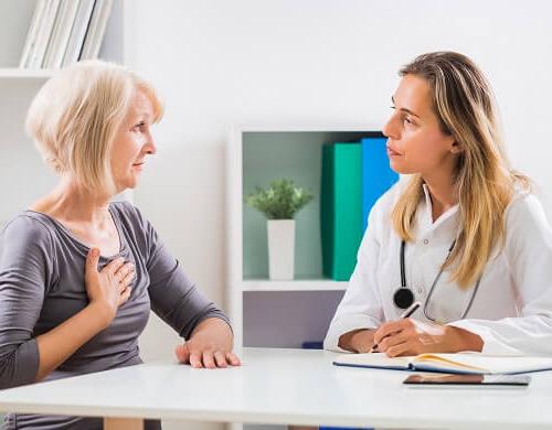 AGNP speaking with patient and taking notes